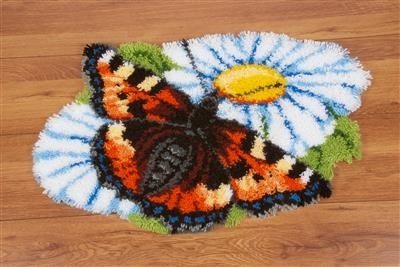 Vlinder op margrieten